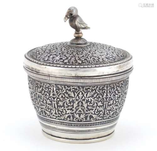 Indian unmarked silver bowl and cover finely embossed with a foliate design and puffin knop,(tests