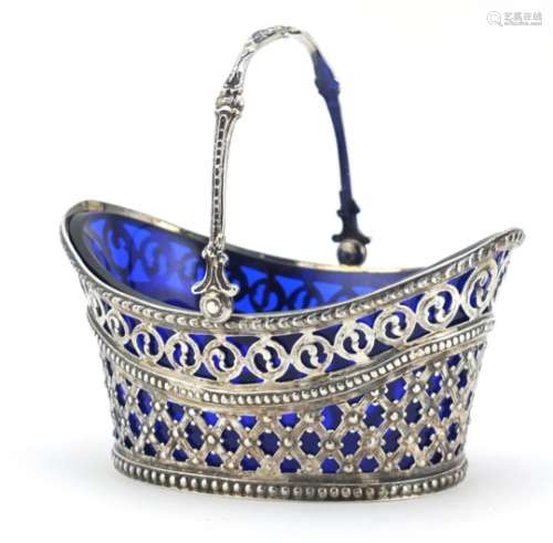 Victorian silver basket by John George Smith with pierced decoration, swing handle and blue glass