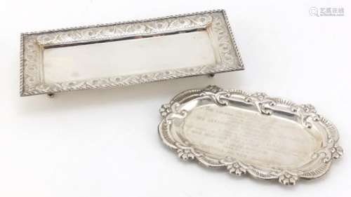Two silver trays, one with Members of the Lohana Dar Es Salaam Community inscription, the largest