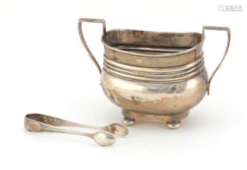Silver twin handled sugar bowl with ball feet and a pair of silver sugar tongs, Birmingham and