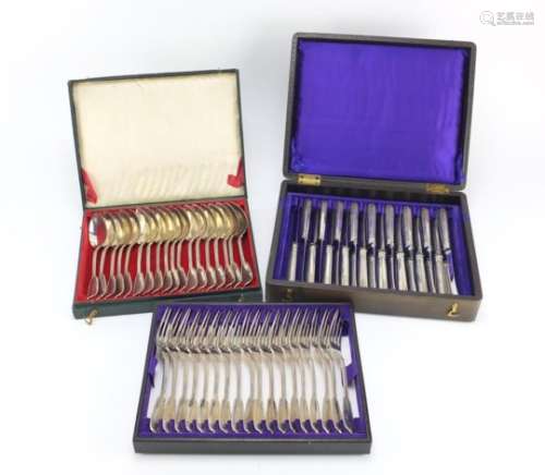 Set of eighteen German silver knives, forks and spoons, all housed in a velvet and silk lined tooled