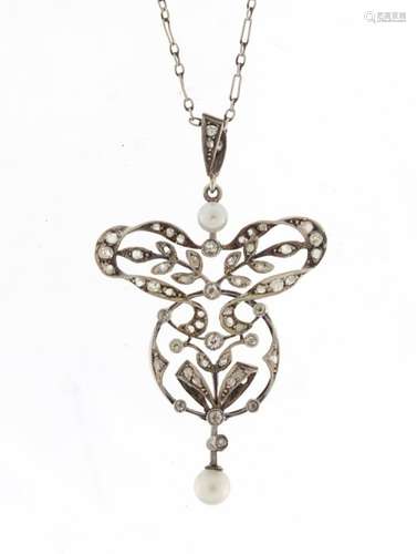 Antique unmarked white metal diamond and pearl pendant on a white metal necklace, the pendant 4.