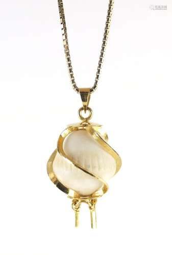 Coconut pearl pendant with gilt metal mounts on a silver gilt necklace, the pendant 3.5cm in length,