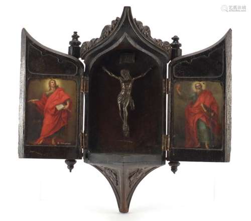 18th century carved oak icon bracket, depicting a crucifixion and two paintings of saints, each