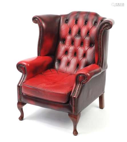 Ox blood leather wing and back armchair, 98cm high : For Further Condition Reports Please Visit