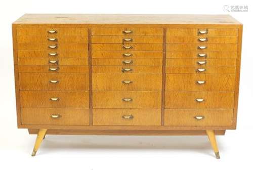 1920's industrial oak multi drawer chest, with baize lined sectional drawers and brass handles, 99.