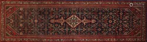 Red ground Hamadan carpet runner, 330cm x 98cm : For Further Condition Reports Please Visit Our