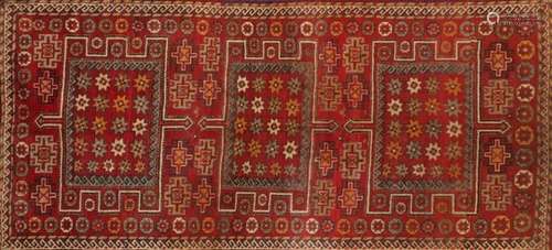 Red ground Baluchi carpet runner, with geometric design 259cm x 98cm : For Further Condition Reports