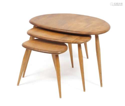 Nest of three Ercol elm pebble tables, the larlgest 40cm high x 65cm wide x 44cm deep : For