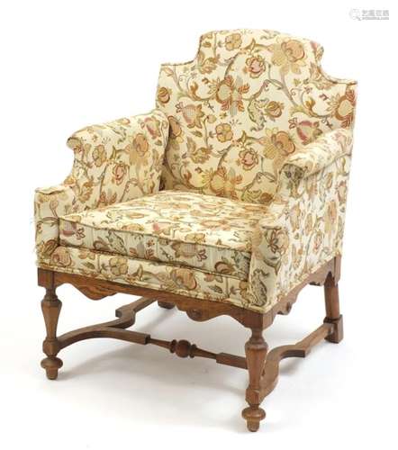 Arts and Crafts design carved oak chair arm chair with cream floral upholstery, 87cm high : For