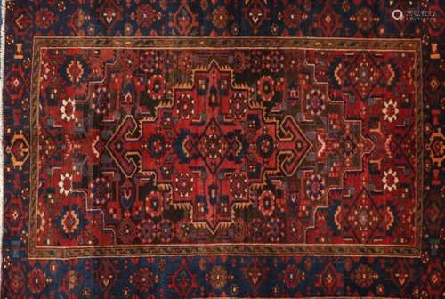 Red ground Heriz rug, 183cm x 127cm : For Further Condition Reports Please Visit Our Website,