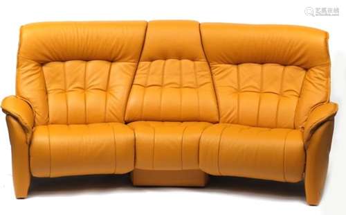 Leather curved three seater reclining settee by Himolla, with fold down central coffee table,