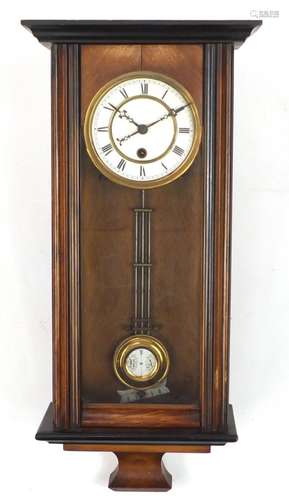 Walnut and ebonised wall clock with enamelled dial and Roman numerals, 64cm high : For Further