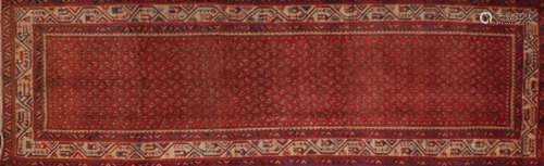 Red ground Araak carpet runner, 315cm x 100cm : For Further Condition Reports Please Visit Our