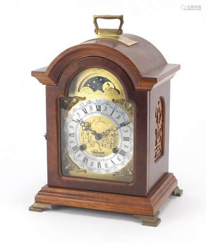 German mahogany cased bracket clock striking on a bell with moon phase dial and silvered chapter