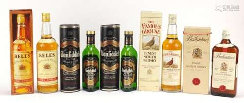 Five bottles of whisky including two 37.5cl bottles, comprising Ballantines, Bells, Famous Grouse