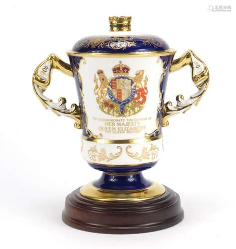 Aynsley Peter Jones Collection twin handled lidded loving cup on stand, commemorating the 90th