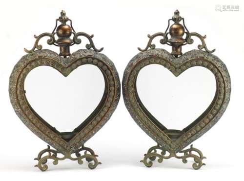 Pair of bronzed love heart shaped candle holders, each 53.5cm high : For Further Condition Reports