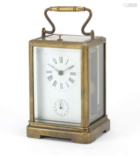 A large brass cased repeating carriage clock having enamelled and subsidiary dials, 14cm high :