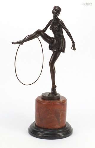 Patinated bronze study of an Art Deco semi nuder performer, raised on a marble base, 48cm high : For