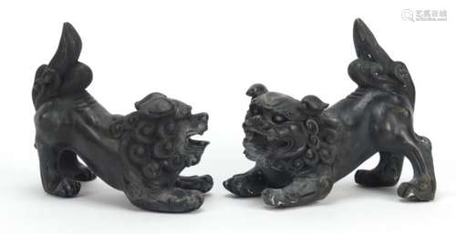 Pair of Chinese patinated bronze Foo dogs, each 15cm in length : For Further Condition Reports