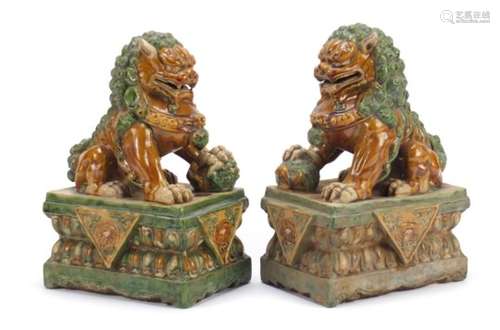 Pair of Chinese archaic style Buddhistic Foos dogs, having a sancai type glaze, each 26cm high : For