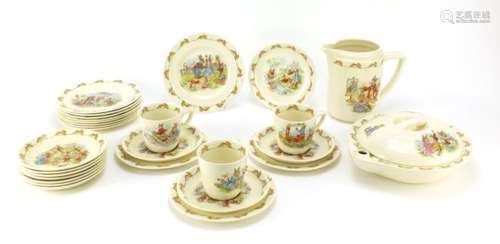 Royal Doulton Bunnykins including food warmer, cups with saucers and a jug, the largest 15cm