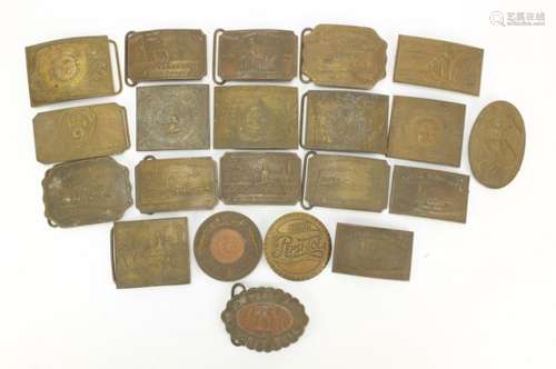 Twenty one bronze and brass buckles by A.J. Nash for Tiffany and Co, the largest 10.5cm in