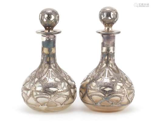 Pair of silver overlaid glass bottles with stoppers, 12cm high : For Further Condition Reports