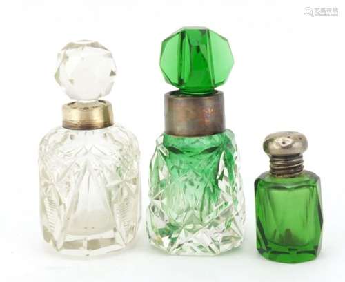 Three cut glass scent bottles with silver collars, various hallmarks, the largest 8cm high : For