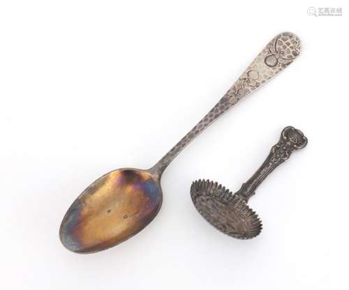 Antique unmarked silver caddy spoon and a sterling silver tablespoon, the largest 17cm in length,