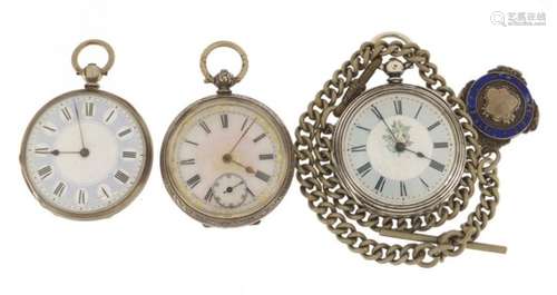 Three ladies silver open face pocket watches with a chain and silver and enamelled jewel, the