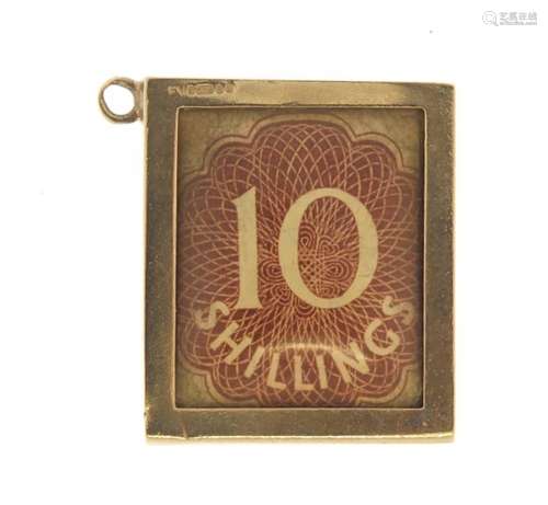 9ct gold emergency 10 shillings note charm, 2.6cm in length, 4.0g : For Further Condition Reports