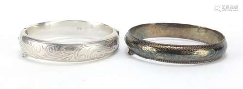 Two silver bangles with engraved decoration, 34.2g : For Further Condition Reports Please Visit