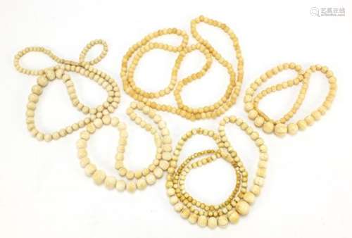 Five graduated ivory bead necklaces, the largest 100cm in length : For Further Condition Reports