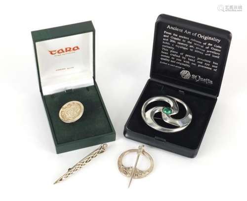 Three silver Scottish design brooches and one other, the largest 6cm in diameter : For Further