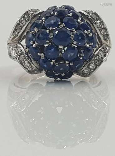 Ring set with 23 sapphires and diamonds.