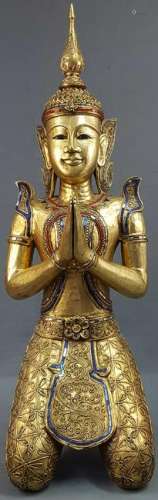 Kneeling Buddha. Carved wood. Gold colored with glass