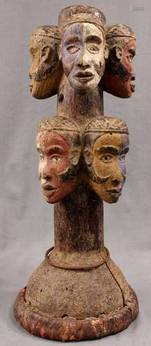 Sculpture. Wood. 8 heads. Probably Congo. 47 cm high.