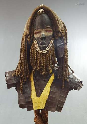 Mask. Wood and textile. 183 cm high with stand. Africa.