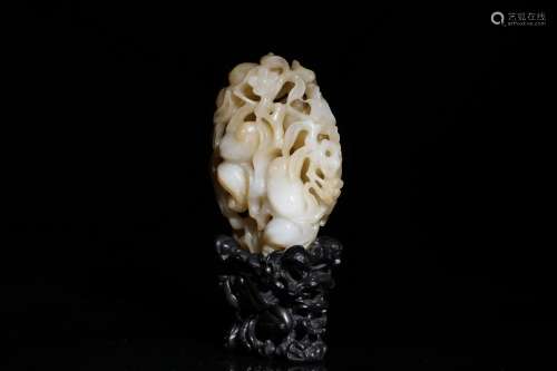 A White Jade Sculpture With Woodcarving Holder
