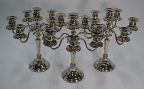 A set of three seven-sconce candelabra