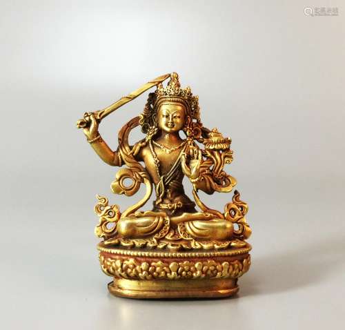 A gold-plated bronze ware Buddha Statue of Manjushri