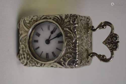 A French unmarked white metal boudoir clock