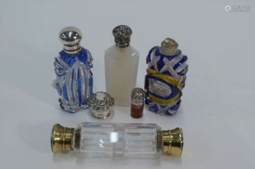 A cut glass double-ended scent flask and other flasks