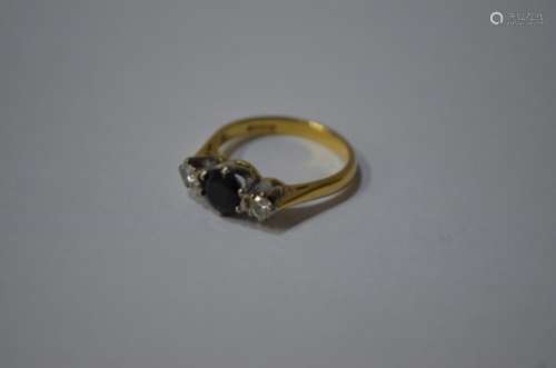 A three stone sapphire and diamond ring