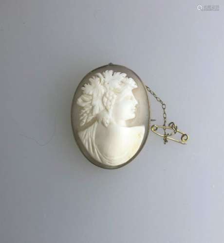 An antique oval shell cameo brooch of a classical god