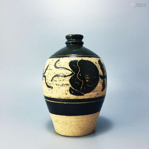 A Tea-dust Glazed Bottle with carved design, Cizhou