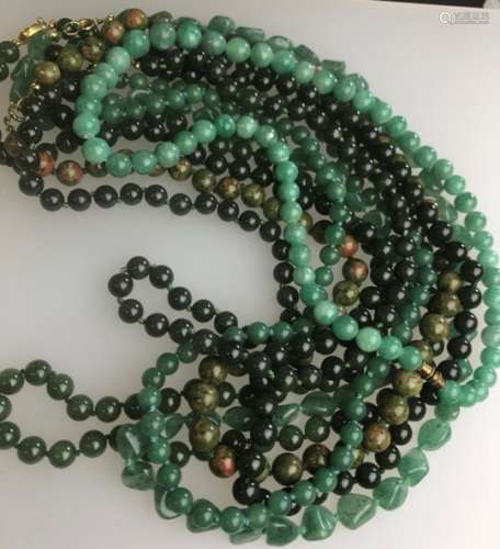 Seven various green glass/hard stone bead necklaces
