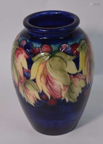 A William Moorcroft ovoid vase decorated with the 'Leaf and Berry' pattern